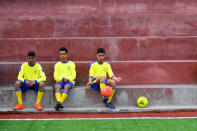 FILE PHOTO: Moatasem Al-Nabeeh, 14, who is diagnosed with cancer, warms up before playing soccer with fellow cancer patients in Gaza City, February 15, 2019. REUTERS/Dylan Martinez