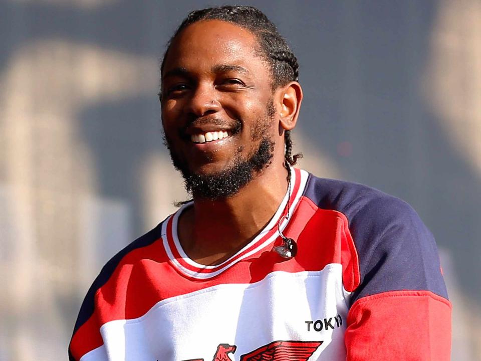 <p>Simone Joyner/Getty</p> Kendrick Lamar performing in Hyde Park in London in July2016