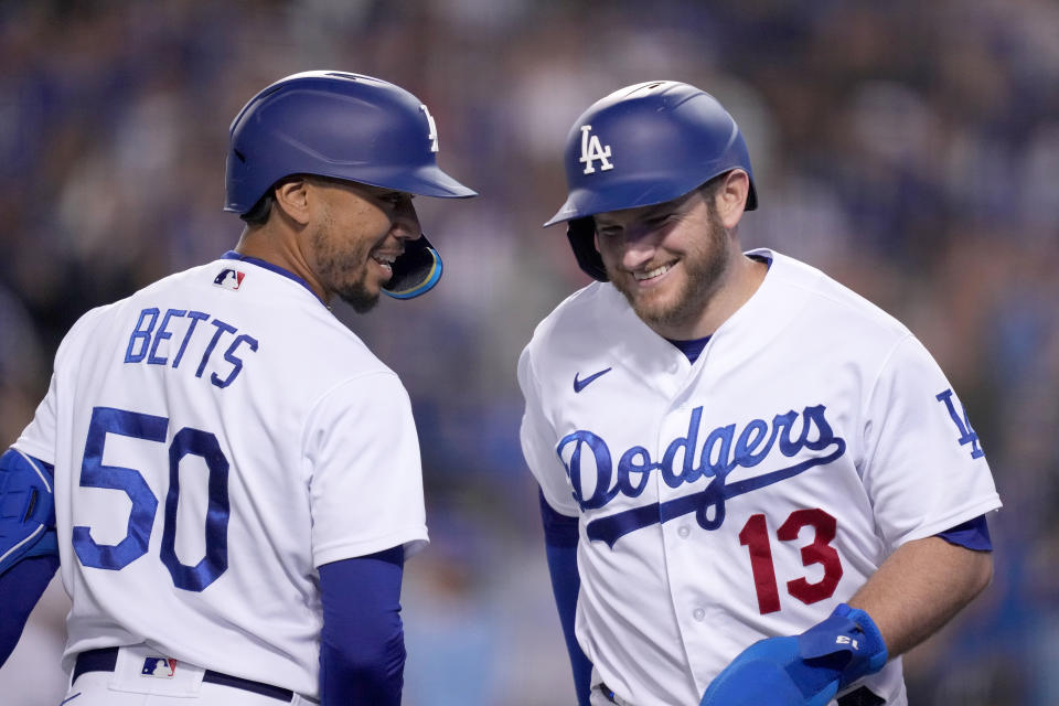 May 4, 2022; Los Angeles, California, USA; MLB Los Angeles Dodgers third baseman Max Muncy (13) celebrates with right fielder Mookie Betts (50) after scoring in the seventh inning against the San Francisco Giants at Dodger Stadium. Mandatory Credit: Kirby Lee-USA TODAY Sports