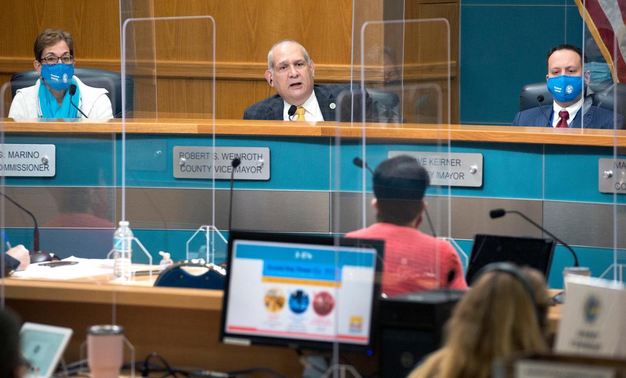Robert S. Weinroth quizzes Palm Beach County Health Director Dr. Alina Alonso as she presents COVID-19 information to commissioners during the County Commission meeting in West Palm Beach Tuesday, January 26, 2021.