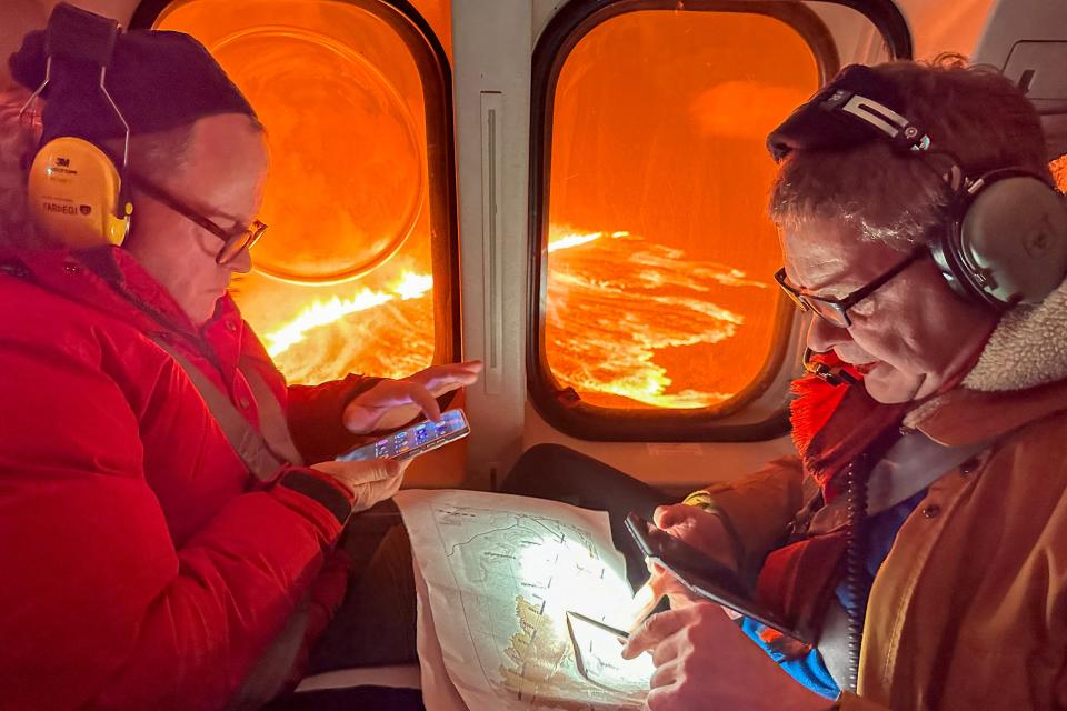 This handout picture released by the Icelandic Coast Guard on March 16, 2024 shows billowing smoke and flowing lava pouring out of a new fissure, during a surveilance flight above a new volcanic eruption on the outskirts of the evacuated town of Grindavik, western Iceland. A volcanic eruption started on the Reykjanes peninsula in southwestern Iceland on Thursday, the third to hit the area since December, authorities said.