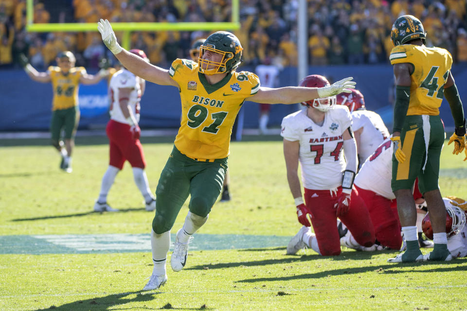 FILE - In this Jan. 5, 2019, file photo, North Dakota State defensive end Derrek Tuszka (91) waves his arms after sacking Eastern Washington quarterback Eric Barriere in the final minutes of the FCS championship NCAA college football game, in Frisco, Texas. Tuszka was selected to The Associated Press FCS All-America first team, Tuesday, Dec. 17, 2019. (AP Photo/Jeffrey McWhorter)