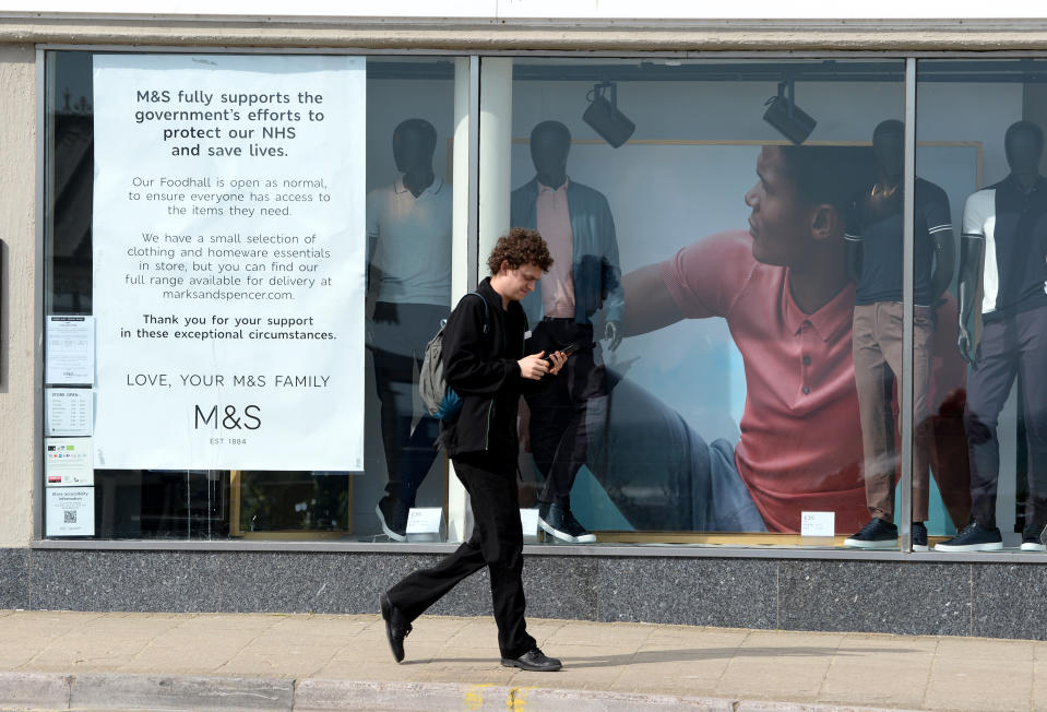 WEYMOUTH, ENGLAND - APRIL 05: A Marks & Spencer shop front information notice on April 05, 2020 in Weymouth, United Kingdom. The Coronavirus (COVID-19) pandemic has spread to many countries across the world, claiming over 60,000 lives and infecting over 1 million people. (Photo by Finnbarr Webster/Getty Images)