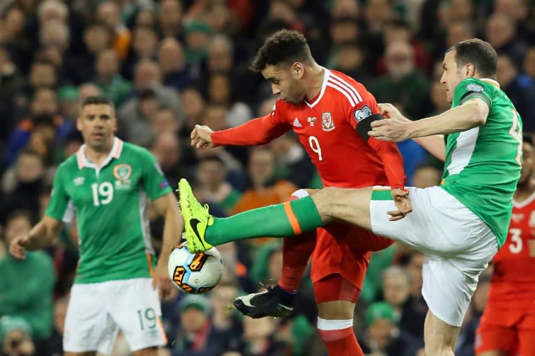 Republic of Ireland's defender John O'Shea (R) vies with Wales's striker Hal Robson-Kanu during the World Cup 2018 qualification football match March 24, 2017