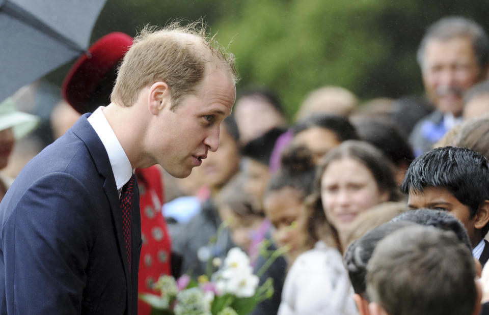 Britain'S Prince William chats with school children at the official welcome ceremony at Government House, in Wellington, New Zealand, Monday, April 7, 2014. Britain's Prince William and his wife, Kate, have arrived in New Zealand's capital to cheers from locals who braved windy, rainy weather to catch a glimpse of the royal couple. (AP Photo/SNPA, Ross Setford) NEW ZEALAND OUT