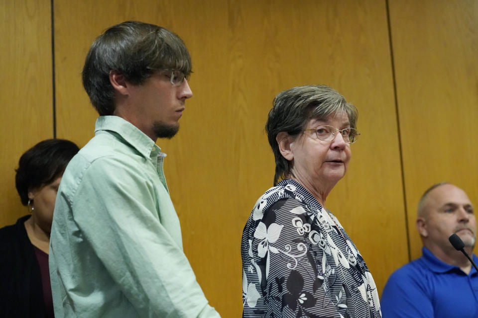 Vicki Moak, mother of slain Brookhaven Police Department Cpl. Zach Moak, speaks directly to her son's admitted killer Marquis Aaron Flowers, in the Lincoln County Circuit Court, moments after he plead guilty to first degree murder in the 2018 shooting deaths of two Brookhaven police officers including Moak, Wednesday morning, Nov. 3, 2021, in Brookhaven, Miss. Moak's younger brother, Chris Moak, stood by his mother's side during the impact statement. Members of the officers' families addressed the court in emotional statements, asking for the maximum sentences to be imposed. (AP Photo/Rogelio V. Solis)