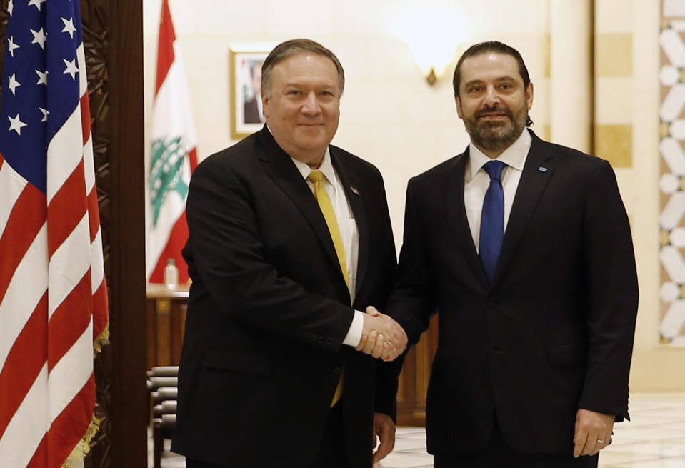 Lebanese Prime Minister Saad Hariri, right, shakes hands with U.S. Secretary of State Mike Pompeo, left, in Beirut, Lebanon, Friday, March. 22, 2019. Pompeo arrived in Lebanon on Friday amid strong regional condemnation of President Donald Trump's declaration that it's time the U.S. recognized Israel's sovereignty over the Israeli-occupied Golan Heights. (AP Photo/Bilal Hussein)