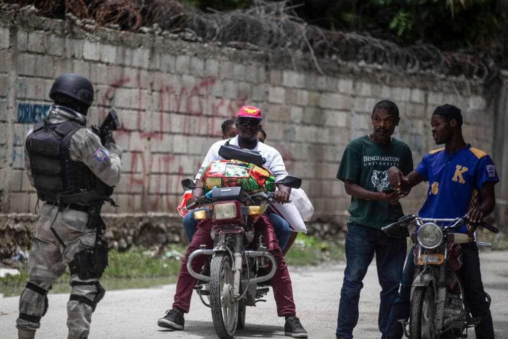 A police officer patrols a street during an anti-gang operation in Croix-des-Missions, north of Port-au-Prince, Haiti, Thursday, April 28, 2022. Haiti’s understaffed and under-resourced police department is roughly made up of 11,000 officers for a country of more than 11 million people. (AP Photo/Odelyn Joseph)