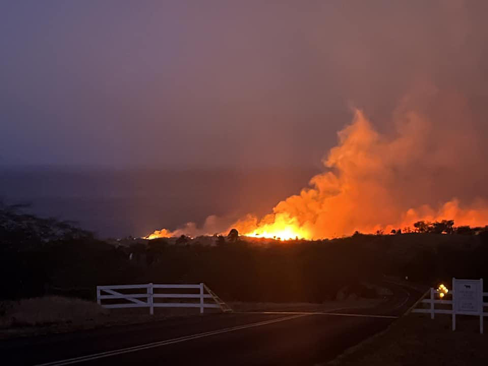 A wildfire burns near Kohala Ranch at the 6-7 mile marker of Akoni Pule Highway on the Big Island.