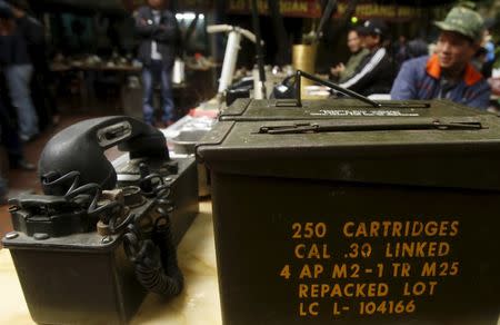 A two-way radio set and a cartridge box of the U.S. military which were used during the Vietnam War are displayed for sale at an old items market in Hanoi March 14, 2015. REUTERS/Kham