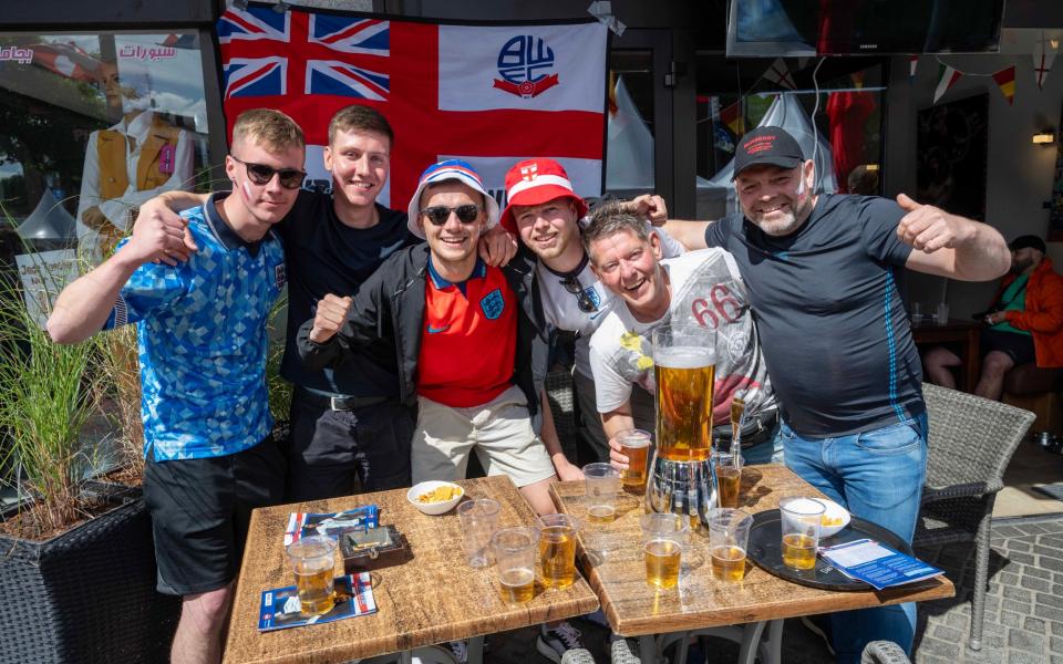 England fans sample local beer in Gelsenkirchen ahead of their team's match against Serbia