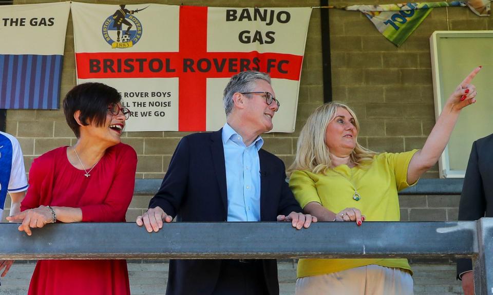 <span>Keir Starmer and Thangam Debbonaire (left) outlined Labour’s plans to reform football governance on a visit to Bristol Rovers.</span><span>Photograph: Geoff Caddick/Getty Images</span>