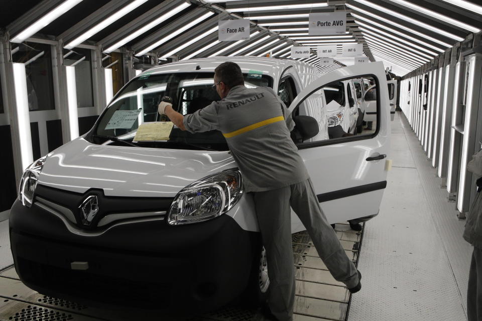 An employee works on French carmaker Renault assembly line at the Maubeuge factory, northern France. Photo: Francois Mori/AP