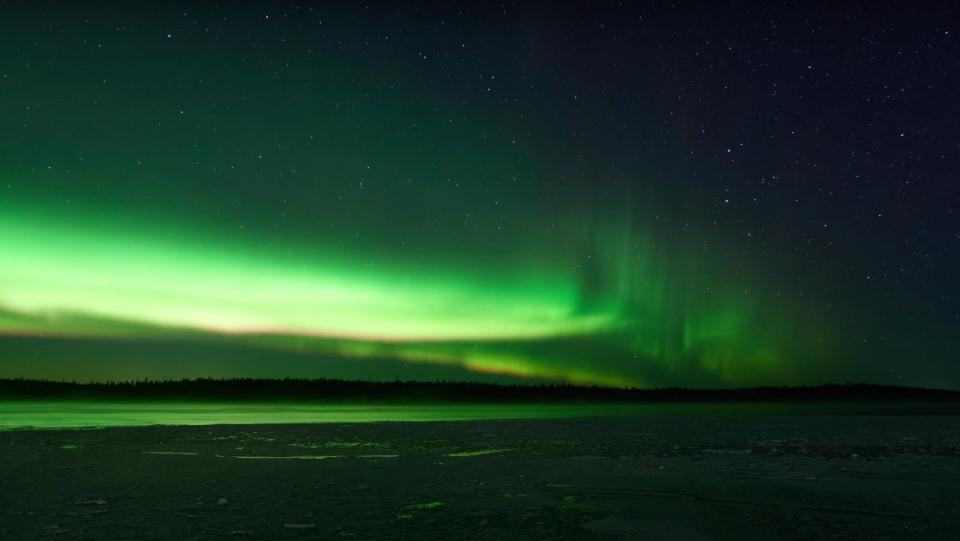 A bright green aurora over Russia's White Sea, captured by marine biologist Alexander Semenov.