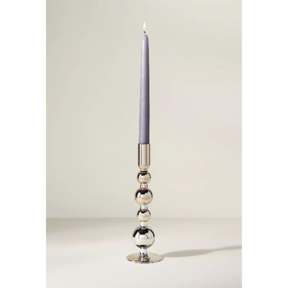 <p><a href="https://go.redirectingat.com?id=74968X1596630&url=https%3A%2F%2Fwww.anthropologie.com%2Fshop%2Fdelaney-candle-holder&sref=https%3A%2F%2Fwww.harpersbazaar.com%2Ffashion%2Ftrends%2Fg4452%2Fgifts-under-100%2F" rel="nofollow noopener" target="_blank" data-ylk="slk:Shop Now;elm:context_link;itc:0;sec:content-canvas" class="link ">Shop Now</a></p><p>Delaney Candle Holder</p><p>anthropologie.com</p><p>$22.00</p><span class="copyright">anthropologie.com</span>