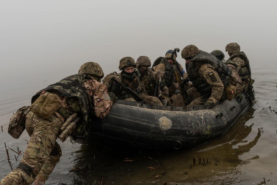 A group of Ukrainian marines sail from the riverbank of Dnipro at the frontline near Kherson, Ukraine, Saturday, Oct. 14, 2023.