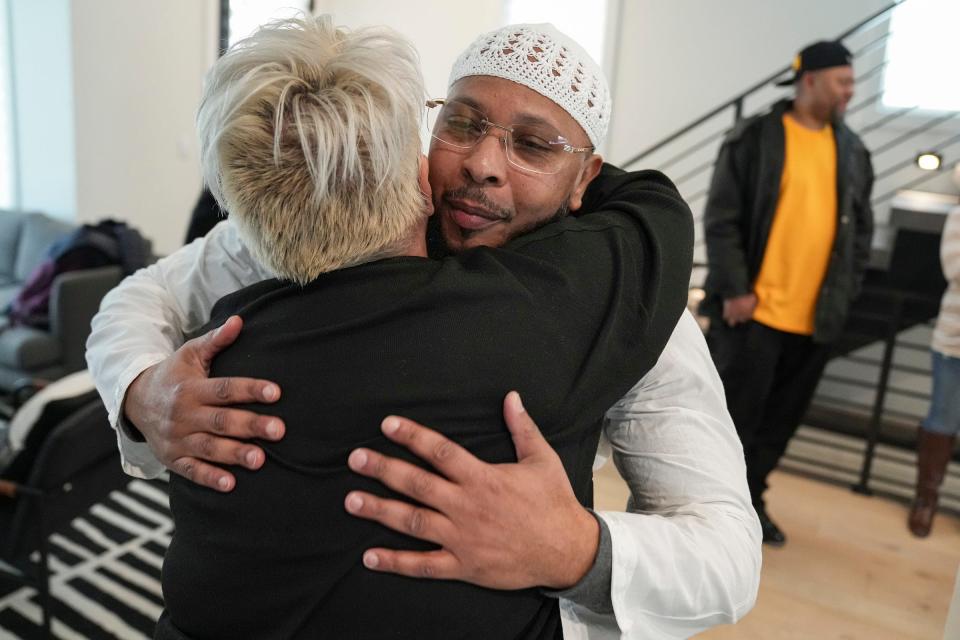 Leon Benson (right) hugs one of the attorneys who worked to have him exonerated, Kelly Bauder, on Thursday, March 9, 2023, after Benson was released from the Correctional Industrial Facility in Pendleton earlier in the day. Benson, 47, spent nearly 25 years in prison for a wrongful conviction in the killing of Kasey Schoen, who was shot in his truck in Indianapolis in August of 1998. An investigation revealed that a police detective failed to disclose critical pieces of evidence, including information implicating someone else in the killing. 