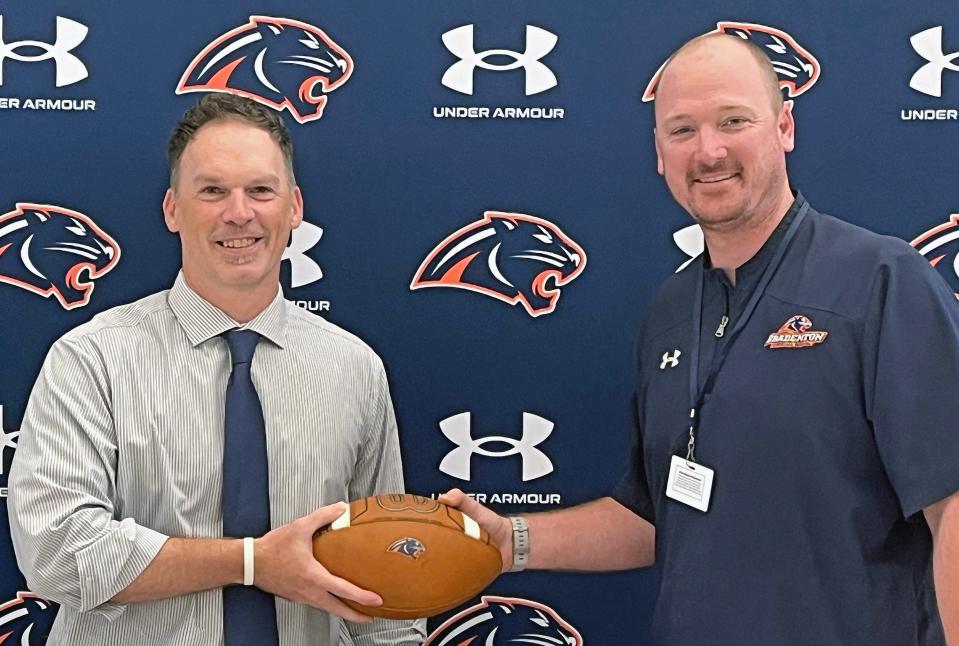 John Warren, left, was introduced as Bradenton Christian School football coach by Panthers director of athletics Cole Hudson on Tuesday, April 11, 2023. Last week, Warren stepped down as coach.