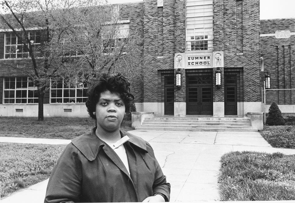 This May 8, 1964 file photo shows Linda Brown Smith standing in front of the Sumner School in Topeka, Kansas. The refusal of the public school to admit Brown in 1951, then nine years old, because she is Black, led to Brown v. Board of Education of Topeka, Kansas.