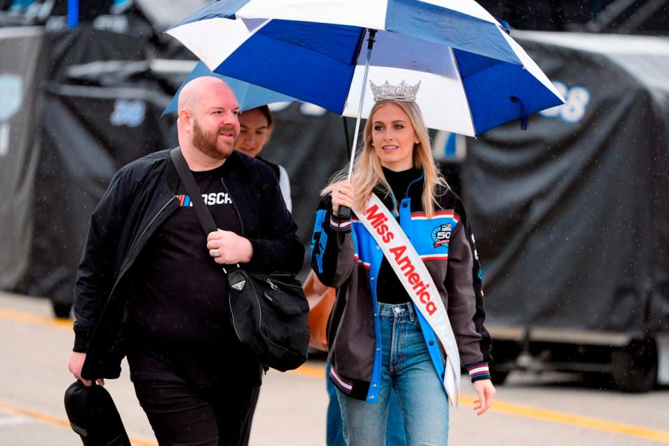 PHOTO: Miss America 2024, Madison Marsh, carries an umbrella before a practice session for the NASCAR Daytona 500 in Daytona Beach, FL, Sat. Feb. 17, 2024. (Chris O'meara/AP)