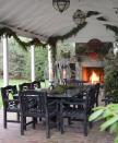 <p>Niki Papadopoulos of Mark Williams Design predicts a turn to the outdoor this season: "I'm seeing a lot more focus on the exterior decor this year," she says. "More lights, more garlands, etc!" Lisa Hilderbrand nailed this look with garlands draped over her outdoor dining pavilion and wreaths acting as centerpieces. </p>