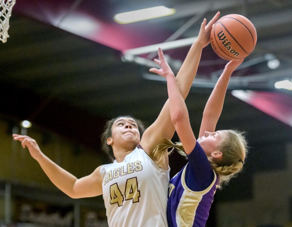 Dunlap's Justice Krus (44) blocks a shot by Canton's Ella Demler in the second half Thursday, Dec. 15, 2022 at Dunlap High School. The Eagles defeated the Little Giants 68-53.