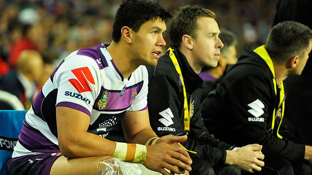 McLean looks on after injuring his knee. Image: Getty