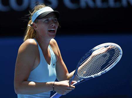 Maria Sharapova of Russia reacts during her women's singles match against Karin Knapp of Italy at the Australian Open 2014 tennis tournament in Melbourne January 16, 2014. REUTERS/David Gray