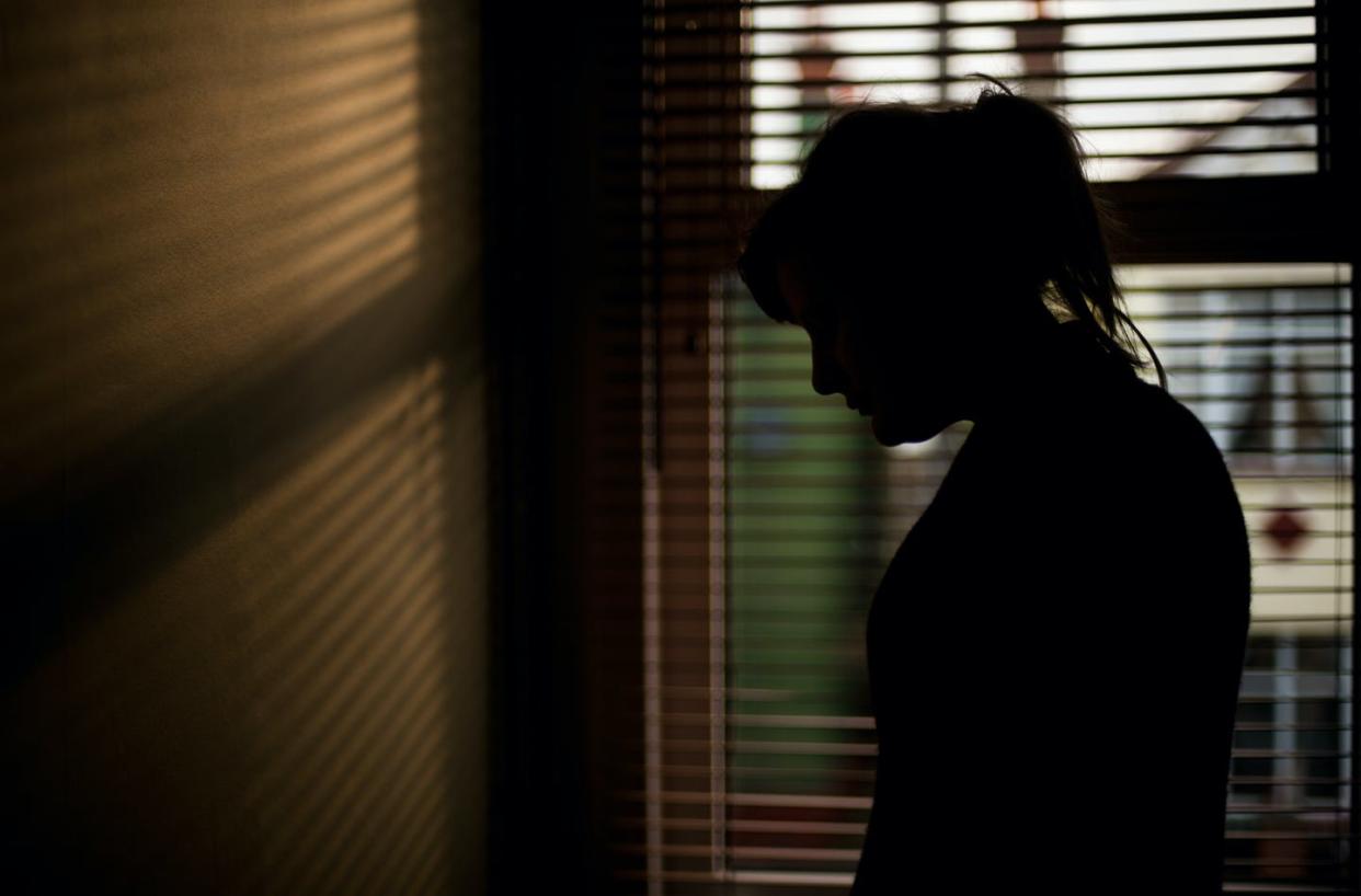 <span class="caption">Shelter-in-place measures have made it more difficult for victims of domestic violence to escape from their abusers.</span> <span class="attribution"><a class="link " href="https://www.gettyimages.com/detail/photo/silhouette-of-woman-by-window-royalty-free-image/535164224" rel="nofollow noopener" target="_blank" data-ylk="slk:Elizabeth Livermore/Moment via Getty Images;elm:context_link;itc:0;sec:content-canvas">Elizabeth Livermore/Moment via Getty Images</a></span>