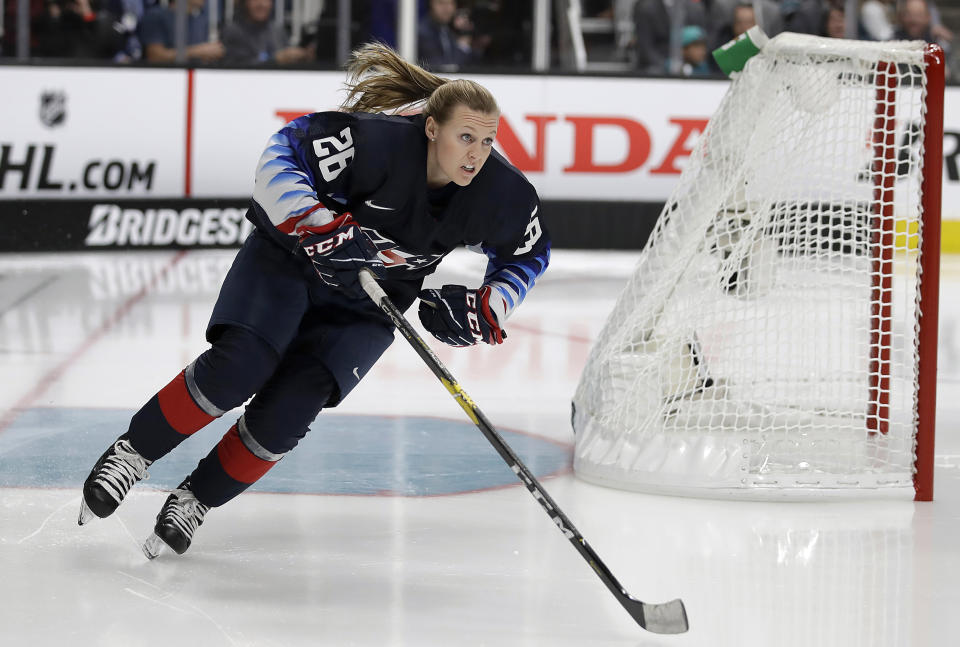 FILE - In this Jan. 25, 2019, file photo, United States' Kendall Coyne Schofield skates during the Skills Competition, part of the NHL All-Star weekend, in San Jose, Calif. The NHL couldn't help but take notice of the buzz Coyne Schofield infused into its midseason showcase of top talent. Chief Content Officer Steve Mayer, who oversees the all-star game's production, chuckled in saying he was already dreaming up ideas to add women players to the event before Coyne Schofield completed her lap. (AP Photo/Ben Margot, File)