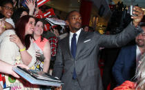 Anthony Mackie (Falcon) helps a fan take a superselfie. Credit: PA