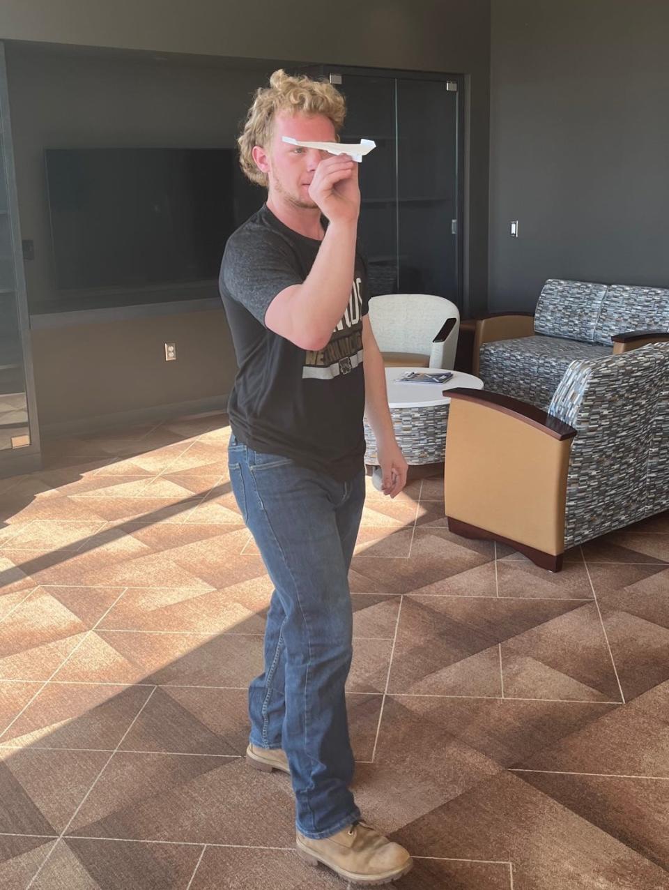 Western Michigan University aviation student Evin Cooper is ready to fly his record-setting paper airplane.