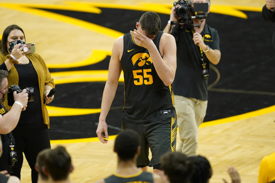 Iowa center Luka Garza walks off the court after an NCAA college basketball game against Wisconsin, Sunday, March 7, 2021, in Iowa City, Iowa. Garza, a senior, was playing his last home game at Iowa. Iowa won 77-73. (AP Photo/Charlie Neibergall)