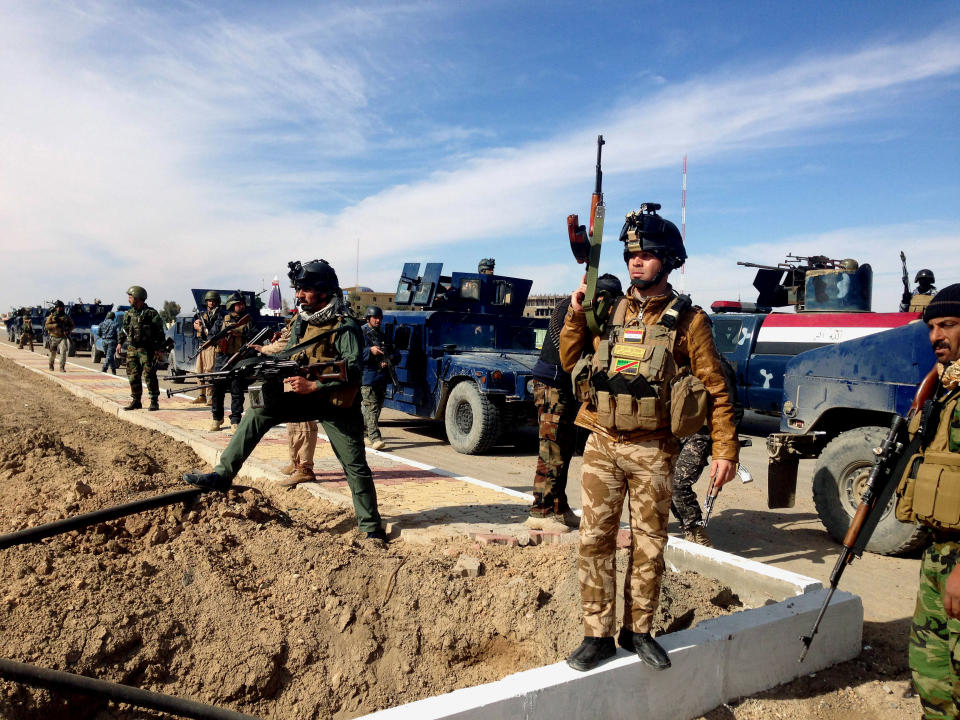 FILE -- In this file picture taken on Sunday, Feb. 2, 2014, Iraqi Security forces prepare to attack al-Qaida positions in Ramadi, 70 miles (115 kilometers) west of Baghdad, Iraq. Militants, many from the al-Qaida-breakaway group Islamic State in Iraq and the Levant, overran Fallujah and parts of Anbar’s capital, Ramadi, at the beginning of 2014, taking advantage of tensions between the Sunni community, which dominates Anbar, and the Shiite-led central government. Since then, government forces backed by Sunni tribal fighters opposed to al-Qaida have battled the militants with little success. (AP Photo, File)