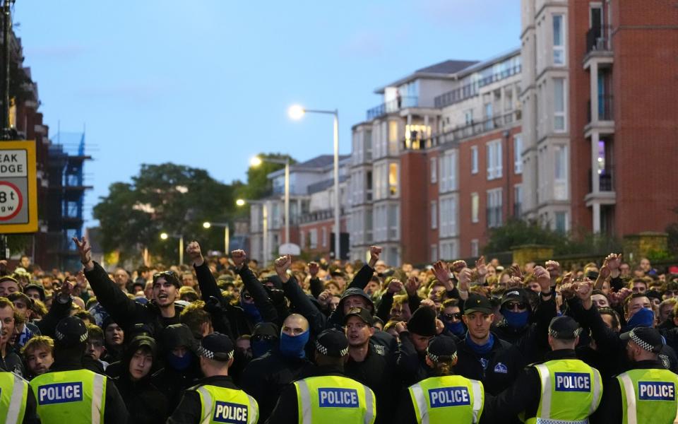 Gent fans march to the ground before the UEFA Conference League match at Stamford Bridge