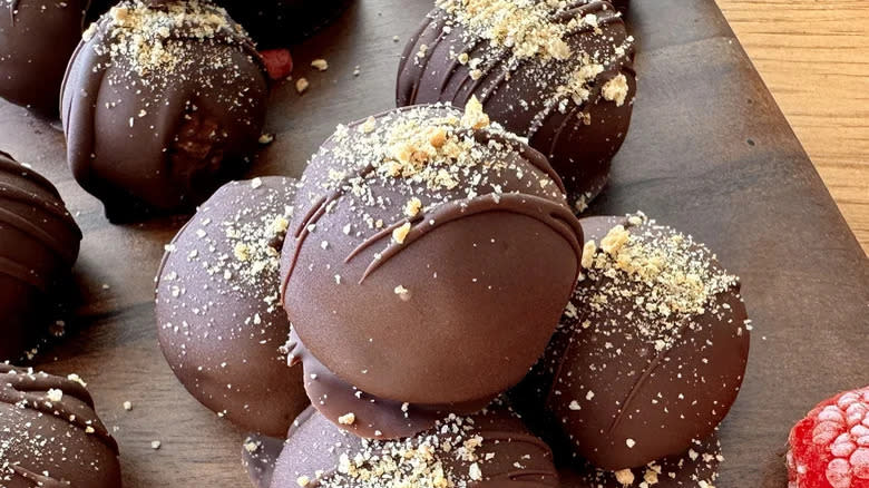 Stack of dark chocolate cheesecake truffles