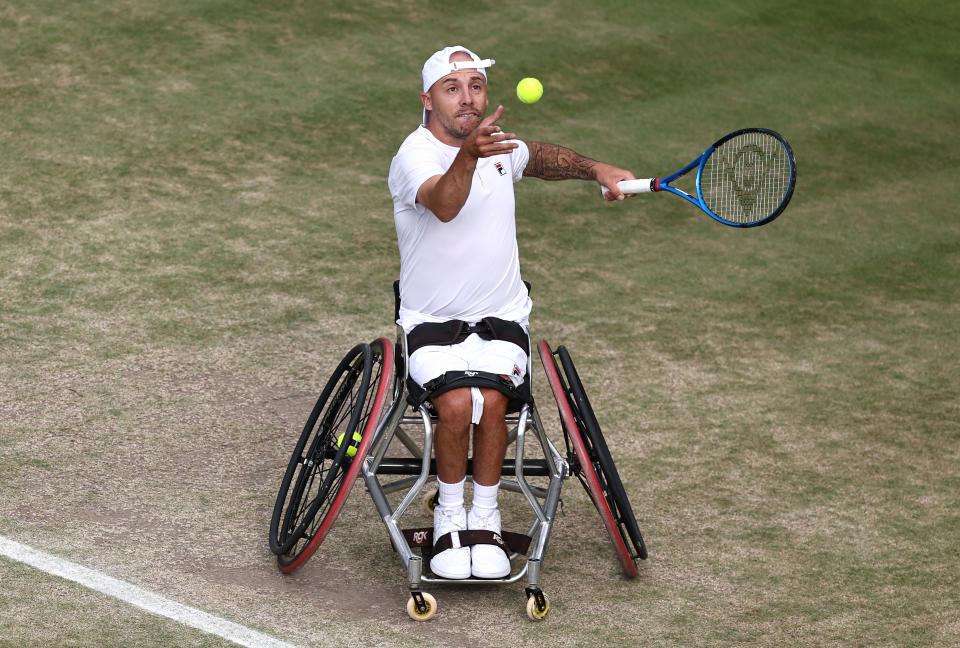 LONDON, ENGLAND - JULY 10: Andy Lapthorne of Great Britain serves to David Wagner of United States in his Quad Wheelchair Singles quarter final match during day ten of The Championships Wimbledon 2024 at All England Lawn Tennis and Croquet Club on July 10, 2024 in London, England. (Photo by Francois Nel/Getty Images)