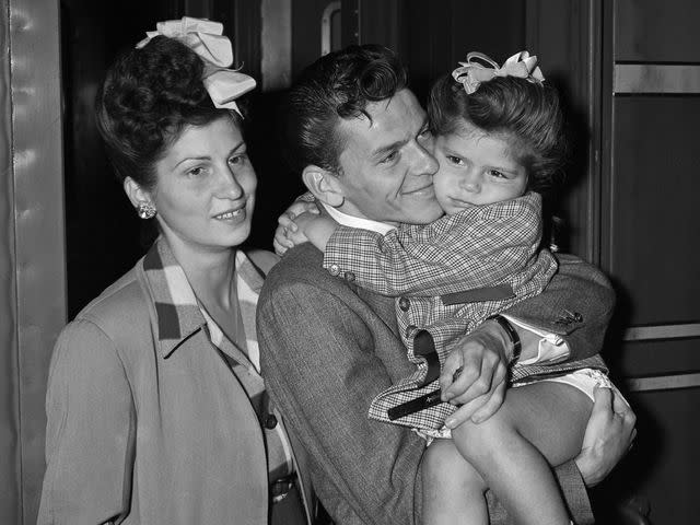 <p>Bettmann</p> Nancy Barbato, Frank Sinatra, and Nancy Sinatra at Grand Central Station in New York City.