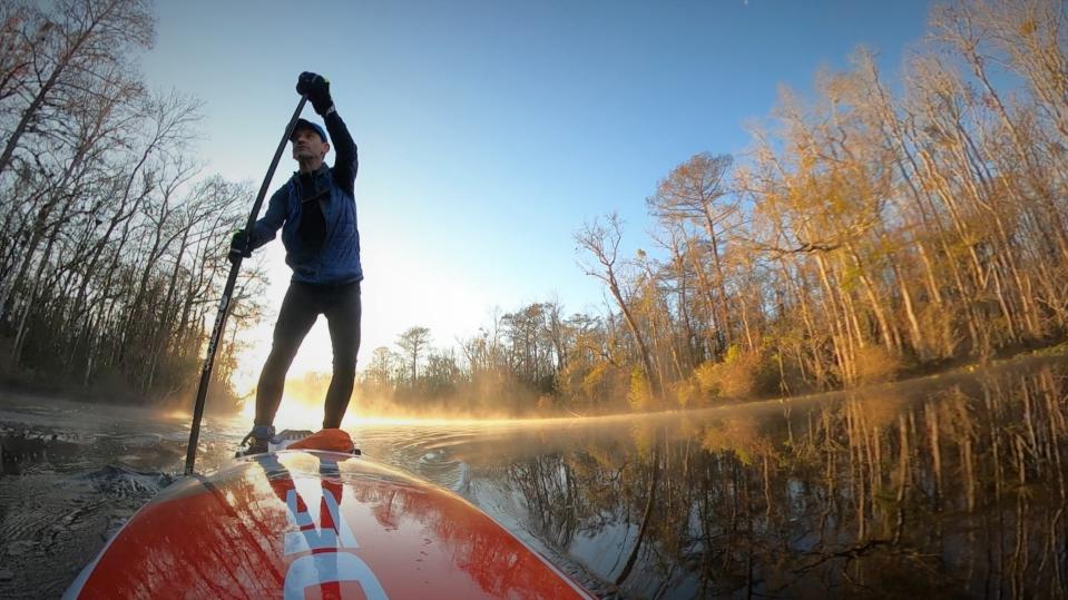 Times-Union columnist Mark Woods paddleboards on Durbin Creek last January.