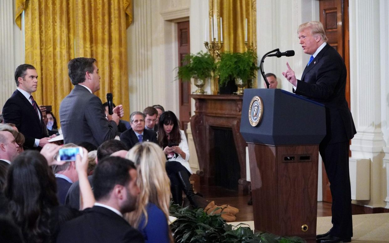 Jim Acosta, CNN's White House correspondent, during an argument with the president which resulted in him having his press pass revoked - AFP