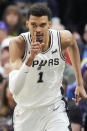 San Antonio Spurs center Victor Wembanyama (1) runs up court after scoring against the Utah Jazz during the first half of an NBA basketball game Wednesday, March 27, 2024, in Salt Lake City. (AP Photo/Rick Bowmer)