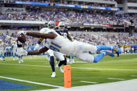 Los Angeles Chargers wide receiver Mike Williams lunges into the end zone for a touchdown during the first half of an NFL football game against the Dallas Cowboys Sunday, Sept. 19, 2021, in Inglewood, Calif. (AP Photo/Ashley Landis)