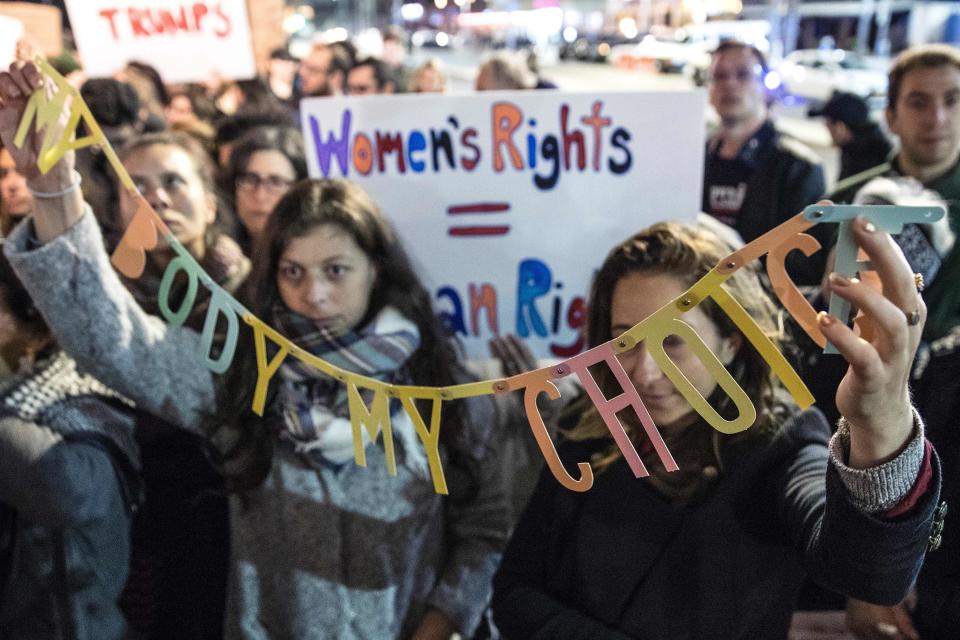 Demonstrators take part in a protest outside the US embassy in the Israeli city of Tel Aviv against President Donald Trump, mirroring worldwide demonstrations to mark his first full day in office, on January 21, 2017. The 'woman's march' demonstration was one of more than 600 being held worldwide, a day after Trump's inauguration on January 20, to condemn his allegedly sexist stances following a series of disparaging comments he made during his presidential campaign.&nbsp;