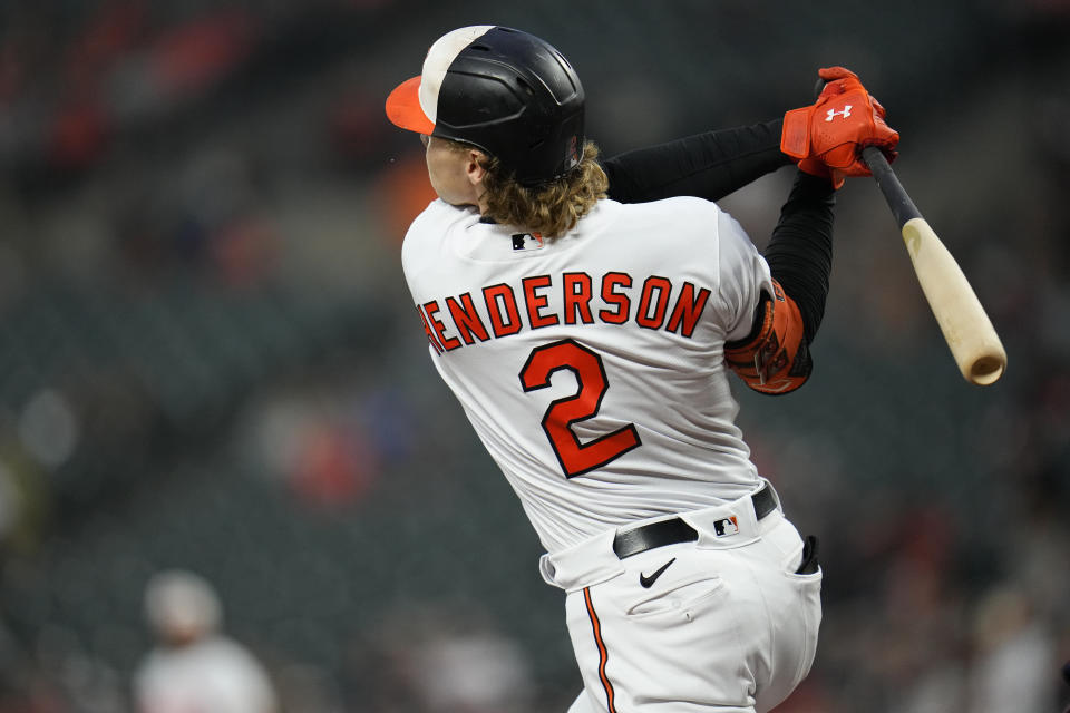 Baltimore Orioles' Gunnar Henderson follows through on a swing while connecting on a leadoff solo home run off Washington Nationals starting pitcher Josiah Gray during the first inning of a baseball game, Tuesday, Sept. 26, 2023, in Baltimore. (AP Photo/Julio Cortez)