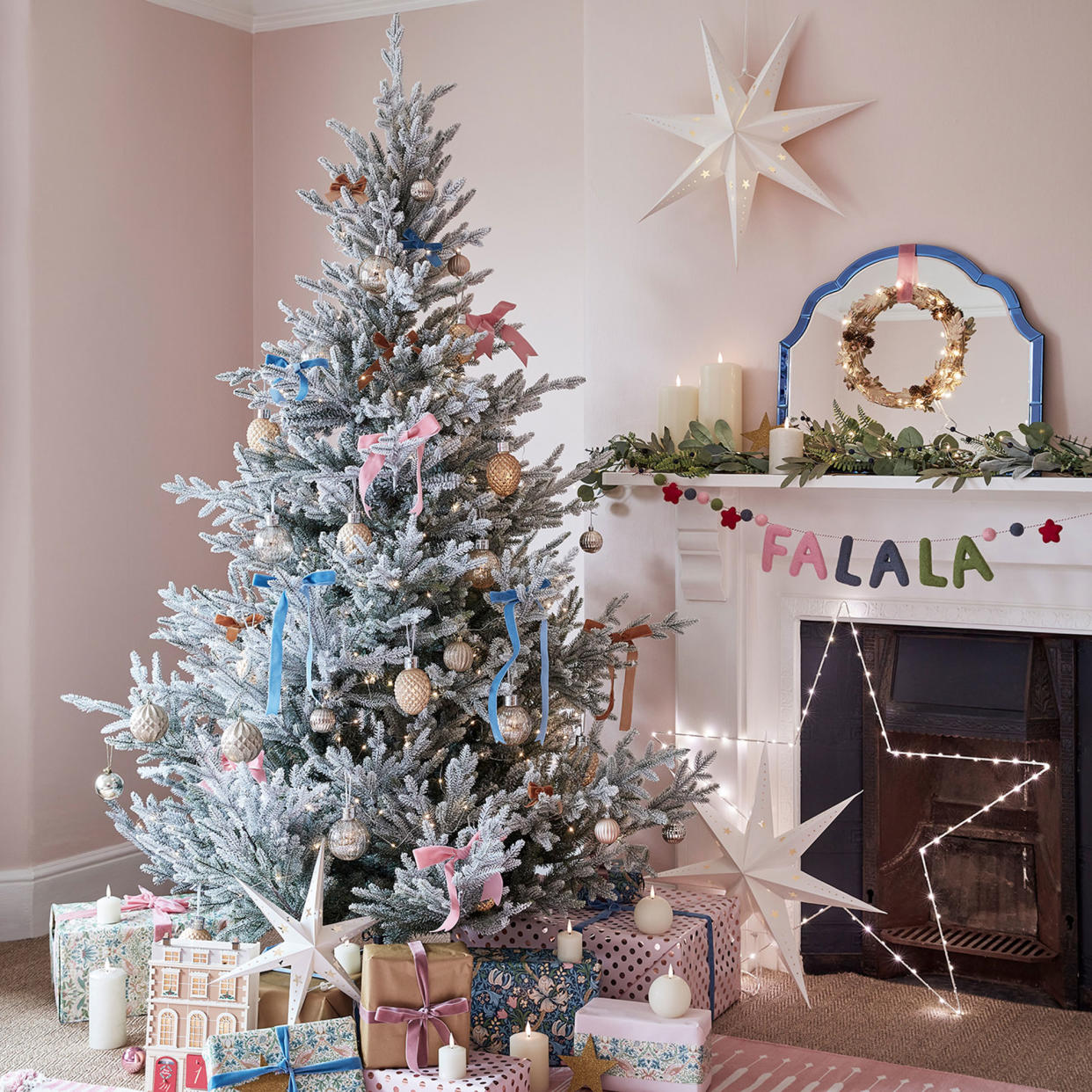  Pink living room with white Christmas tree. 