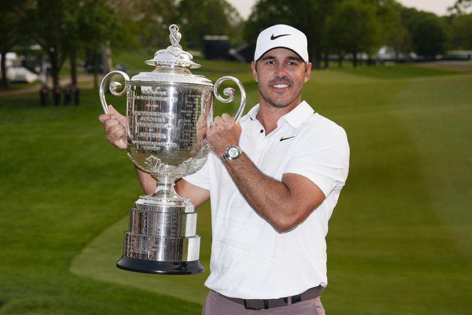 Brooks Koepka holds the Wanamaker trophy after winning the PGA Championship golf tournament at Oak Hill Country Club on Sunday, May 21, 2023, in Pittsford, N.Y. (AP Photo/Seth Wenig)