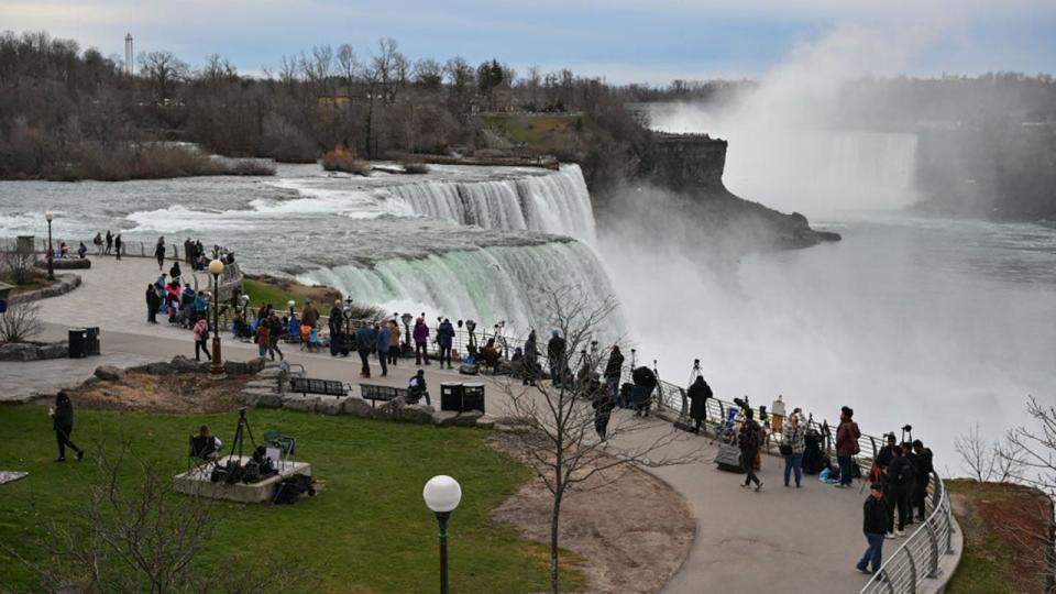 <div>People gather at Niagara Falls State Park ahead of a total solar eclipse across North America, in Niagara Falls, New York, on April 8, 2024. (Photo by ANGELA WEISS/AFP via Getty Images)</div>