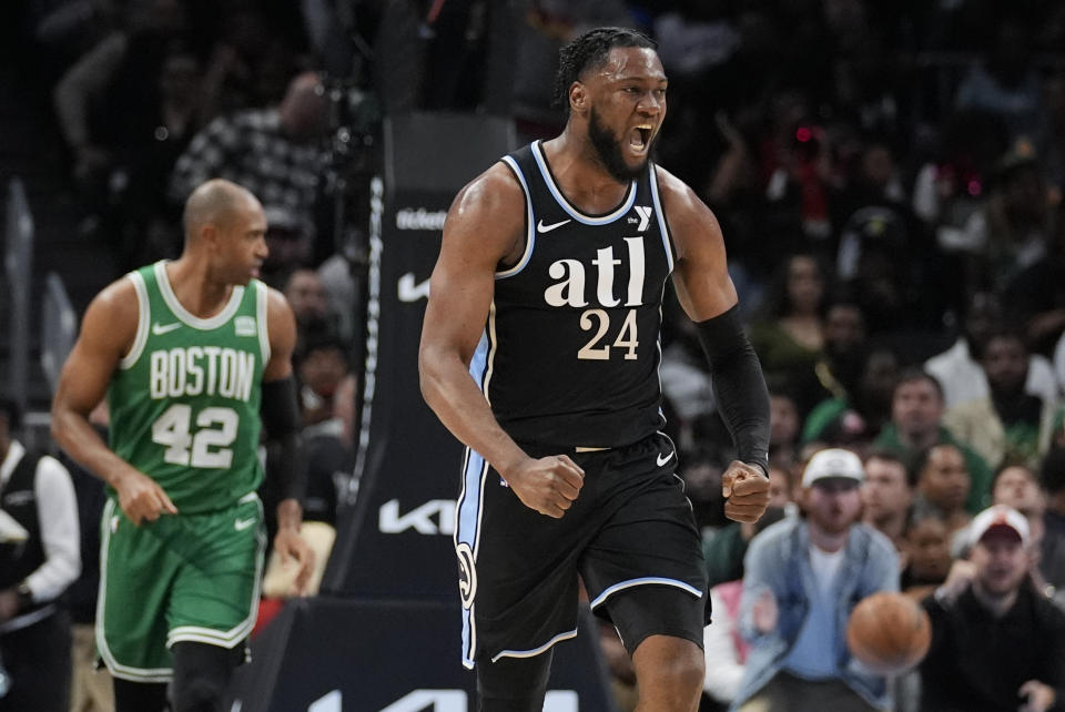 Atlanta Hawks forward Bruno Fernando (24) reacts after a Hawks' basket during the second half of an NBA basketball game against the Boston Celtics Monday, March 25, 2024, in Atlanta. (AP Photo/John Bazemore)