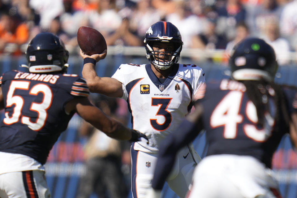 Denver Broncos quarterback Russell Wilson passes as Chicago Bears linebacker T.J. Edwards (53) defends during the second half of an NFL football game Sunday, Oct. 1, 2023, in Chicago. (AP Photo/Erin Hooley) ORG XMIT: CXB161