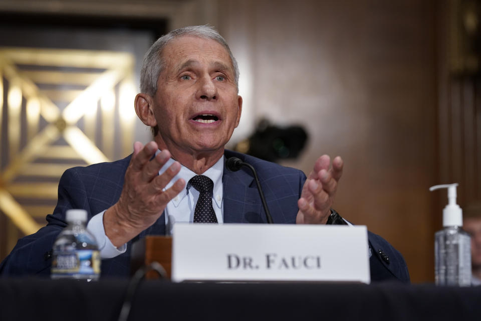 FILE - In this July 20, 2021 file photo, top infectious disease expert Dr. Anthony Fauci responds to accusations by Sen. Rand Paul, R-Ky., as he testifies before the Senate Health, Education, Labor, and Pensions Committee, on Capitol Hill in Washington. Fauci says on Thursday, Aug. 12, an additional COVID-19 booster shot will be recommended for previously vaccinated people with weakened immune systems. He told NBC’s ”Today” show he expects the booster recommendation to come “imminently.” (AP Photo/J. Scott Applewhite, Pool)